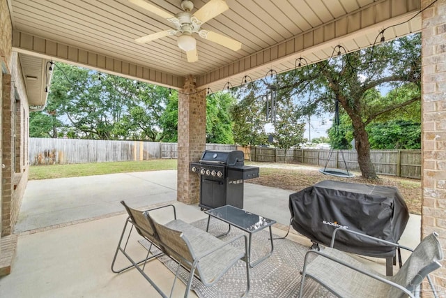 1824 Lindsey Magnolia Ct, Navarre, FL 32566 - fenced backyard featuring a ceiling fan, a patio, and grilling area