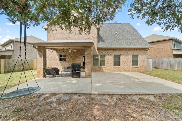 1824 Lindsey Magnolia Ct, Navarre, FL 32566 - back of property featuring a patio area, brick siding, a shingled roof, and ceiling fan
