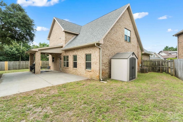 1824 Lindsey Magnolia Ct, Navarre, FL 32566 - back of house with a patio, roof with shingles, central air condition unit, and brick siding