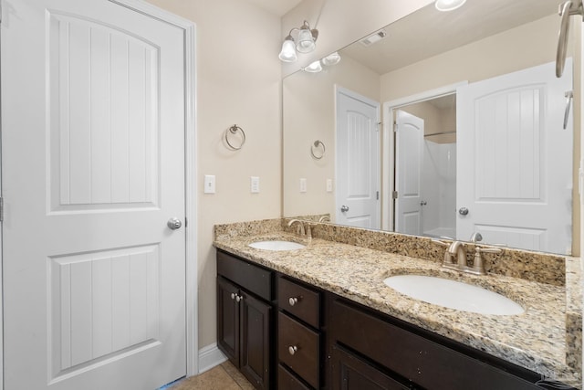 1824 Lindsey Magnolia Ct, Navarre, FL 32566 - bathroom with double vanity and tile patterned floors