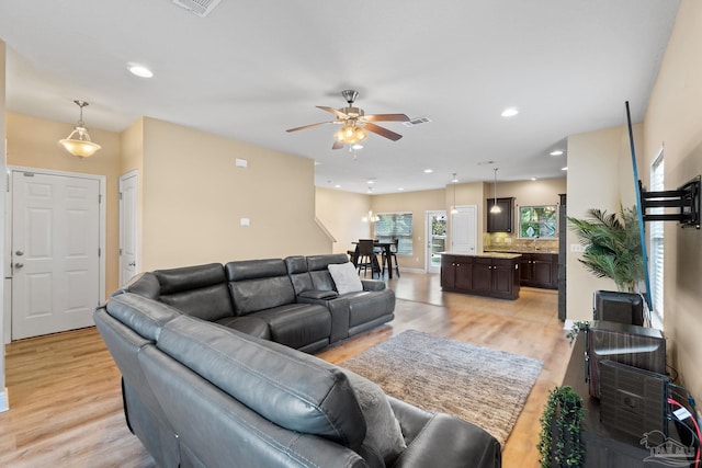 1824 Lindsey Magnolia Ct, Navarre, FL 32566 - living area featuring light wood-style floors, ceiling fan, and recessed lighting