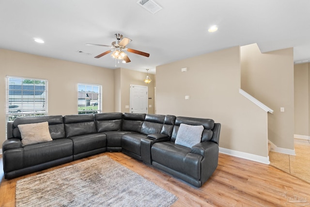 1824 Lindsey Magnolia Ct, Navarre, FL 32566 - living area with a ceiling fan, stairway, light wood-type flooring, recessed lighting, and baseboards