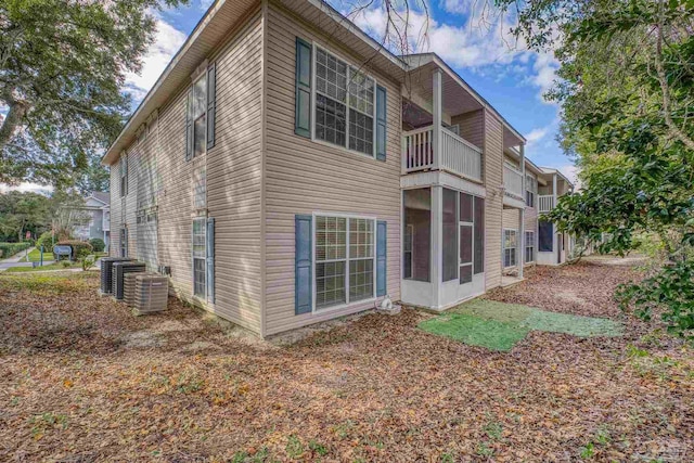 view of side of home featuring central AC unit