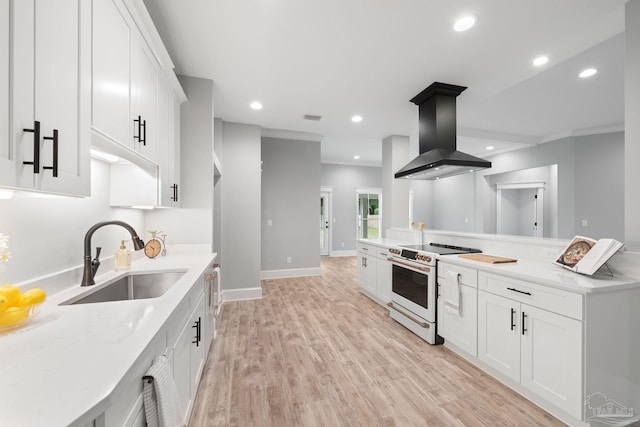 kitchen with sink, white electric range, white cabinetry, and island exhaust hood