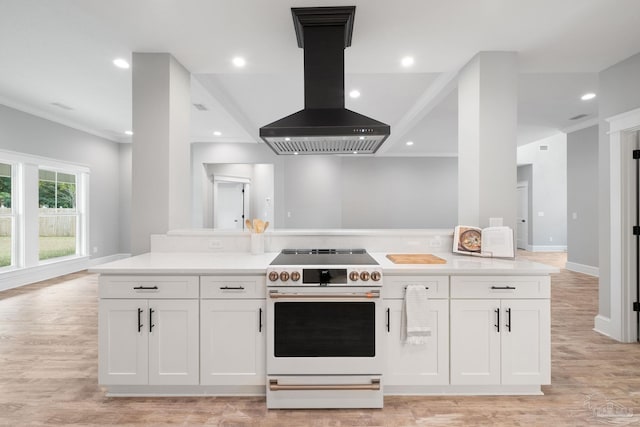 kitchen featuring white cabinetry, custom range hood, high end range, and light wood-type flooring