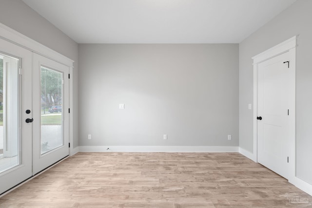 interior space with french doors and light wood-type flooring