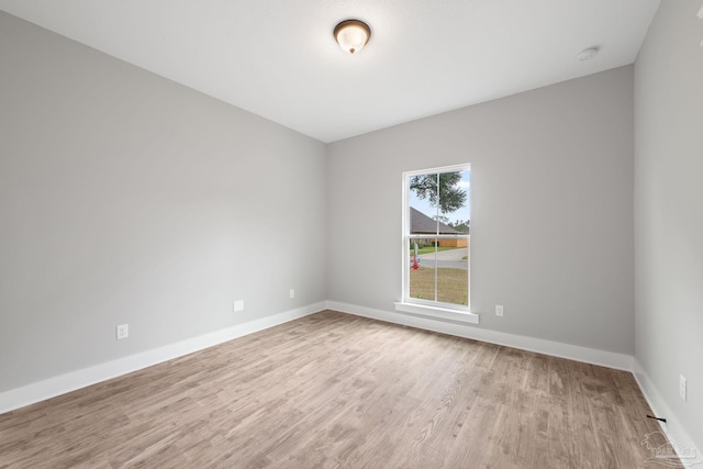 unfurnished room featuring light hardwood / wood-style floors