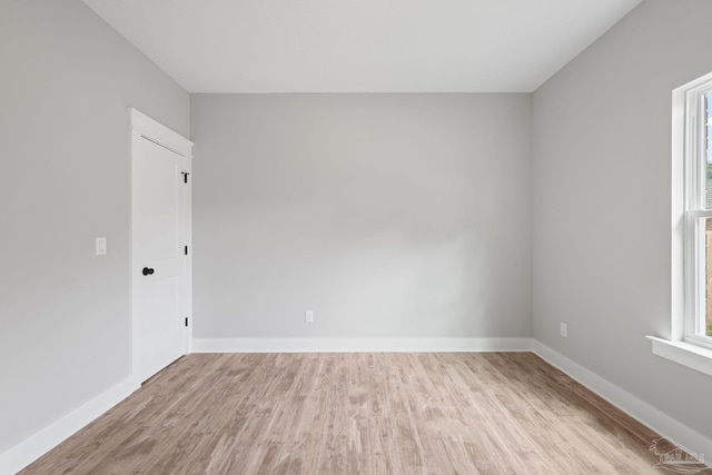 unfurnished room with light hardwood / wood-style flooring