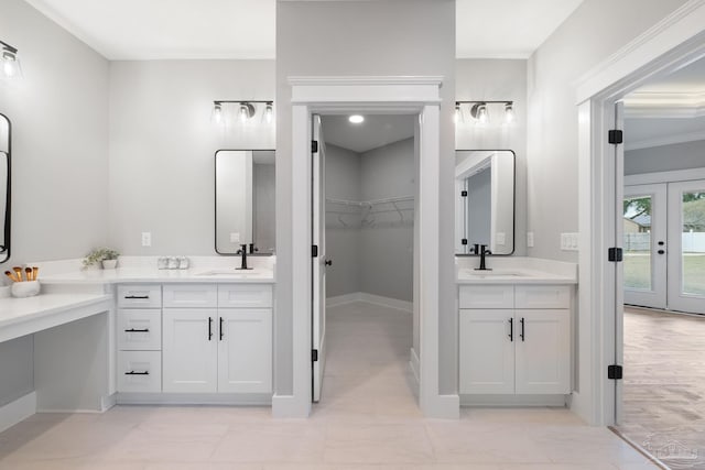 bathroom featuring vanity and crown molding