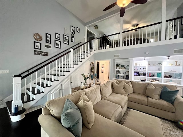39 Blithewood Dr, Pensacola, FL 32514 - living room with a high ceiling, stairs, ceiling fan, and built in features