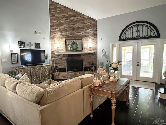 39 Blithewood Dr, Pensacola, FL 32514 - living area featuring lofted ceiling, dark wood-style floors, and a fireplace