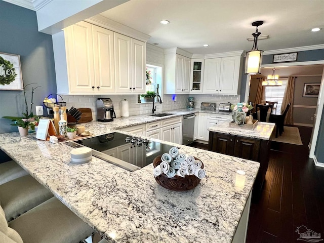 39 Blithewood Dr, Pensacola, FL 32514 - kitchen featuring a sink, dishwasher, a peninsula, tasteful backsplash, and glass insert cabinets