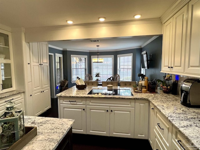 39 Blithewood Dr, Pensacola, FL 32514 - kitchen featuring black electric stovetop, white cabinetry, a peninsula, crown molding, and recessed lighting