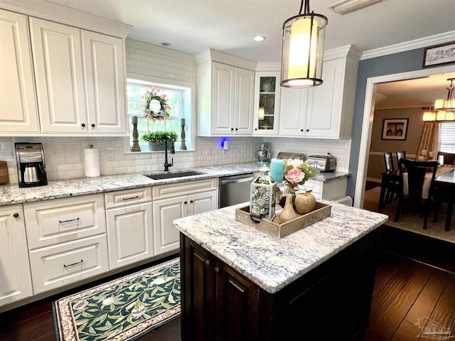 39 Blithewood Dr, Pensacola, FL 32514 - kitchen featuring a sink, dishwasher, backsplash, white cabinetry, and crown molding