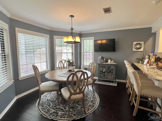 39 Blithewood Dr, Pensacola, FL 32514 - dining area with baseboards, dark wood-style flooring, and crown molding