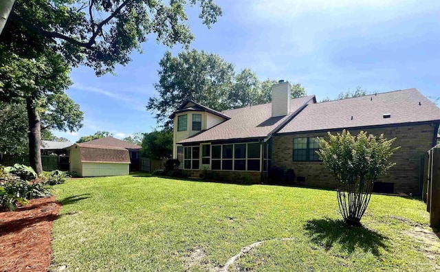 39 Blithewood Dr, Pensacola, FL 32514 - view of yard with a sunroom and an outdoor structure