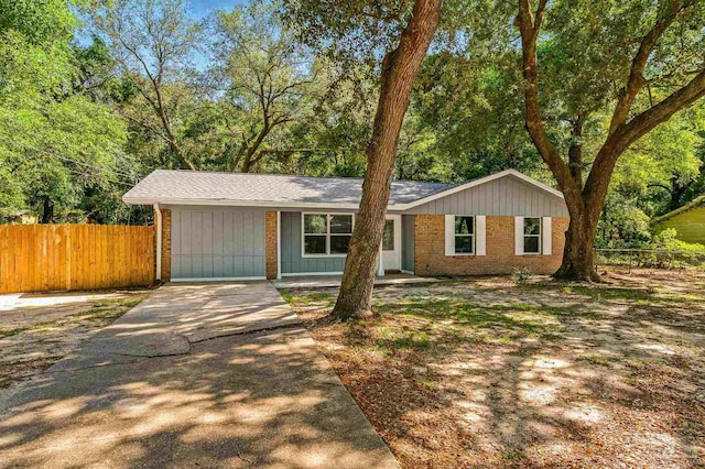 6257 Mohawk Trl, Milton, FL 32583 - ranch-style house featuring brick siding, fence, driveway, and a shingled roof