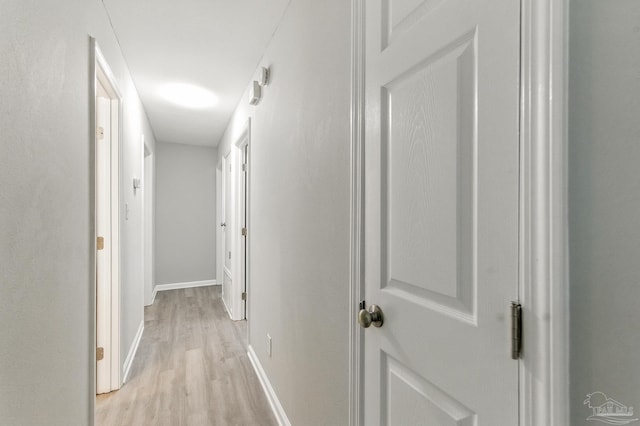 6257 Mohawk Trl, Milton, FL 32583 - hallway with light wood-style flooring and baseboards