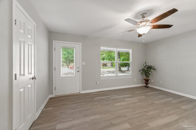 6257 Mohawk Trl, Milton, FL 32583 - foyer entrance featuring light wood finished floors, ceiling fan, and baseboards