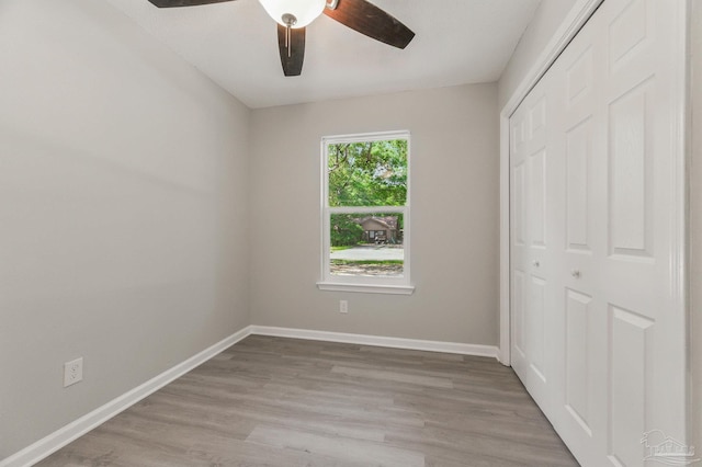 6257 Mohawk Trl, Milton, FL 32583 - unfurnished bedroom featuring a closet, wood finished floors, baseboards, and ceiling fan