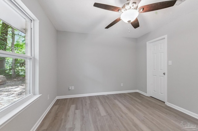 6257 Mohawk Trl, Milton, FL 32583 - empty room with plenty of natural light, light wood-style flooring, ceiling fan, and baseboards