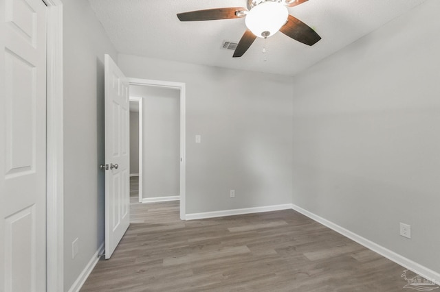 6257 Mohawk Trl, Milton, FL 32583 - empty room with wood finished floors, baseboards, and ceiling fan
