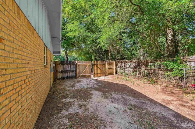 6257 Mohawk Trl, Milton, FL 32583 - view of yard featuring fence and a gate