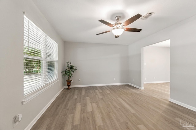 6257 Mohawk Trl, Milton, FL 32583 - empty room featuring light wood-style flooring, a ceiling fan, and baseboards