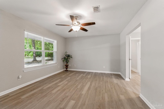 6257 Mohawk Trl, Milton, FL 32583 - empty room with light wood-style floors, a ceiling fan, and baseboards