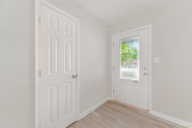 6257 Mohawk Trl, Milton, FL 32583 - doorway featuring light wood finished floors and baseboards