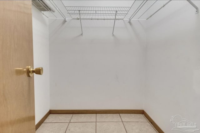 walk in closet featuring light tile patterned floors