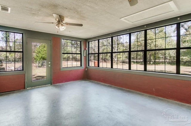 unfurnished sunroom with ceiling fan and visible vents