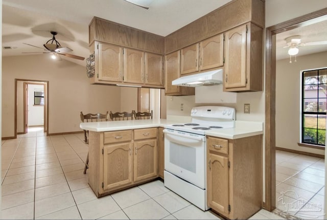 kitchen featuring a ceiling fan, light countertops, under cabinet range hood, and white electric range oven