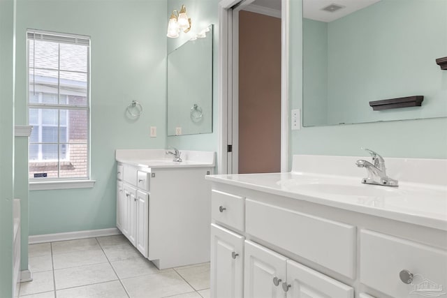 full bathroom featuring visible vents, tile patterned flooring, a sink, and a wealth of natural light