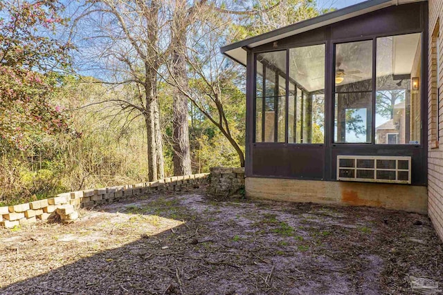 view of side of home with a sunroom