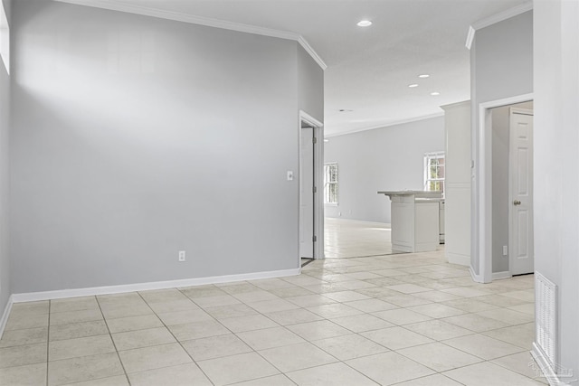 empty room featuring light tile patterned flooring, recessed lighting, visible vents, baseboards, and crown molding