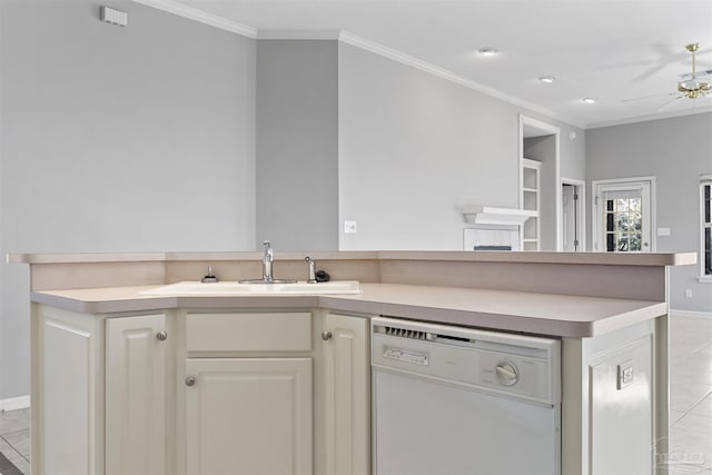 kitchen featuring dishwasher, light countertops, a sink, and crown molding