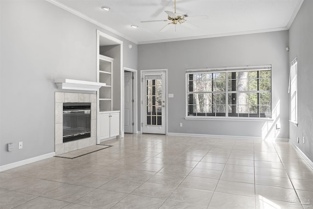 unfurnished living room featuring light tile patterned floors, built in shelves, and baseboards