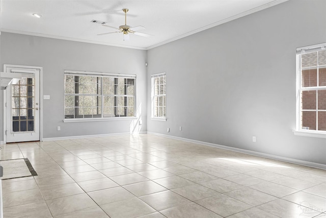 unfurnished room with light tile patterned floors, a ceiling fan, baseboards, visible vents, and crown molding