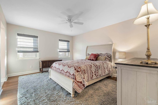 bedroom featuring ceiling fan and dark hardwood / wood-style flooring