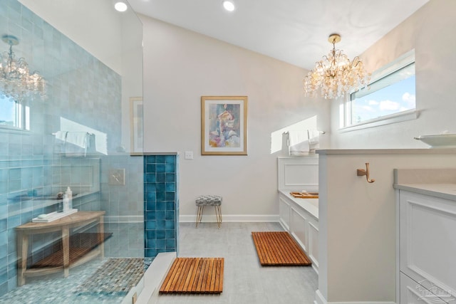 bathroom featuring separate shower and tub, vanity, and a chandelier