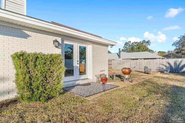 view of yard featuring french doors