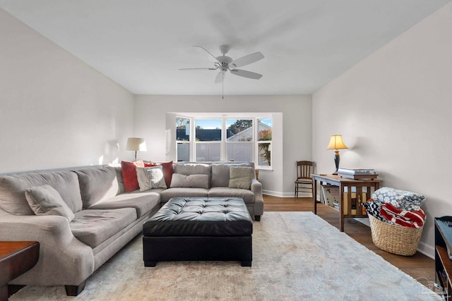 living room featuring hardwood / wood-style flooring and ceiling fan