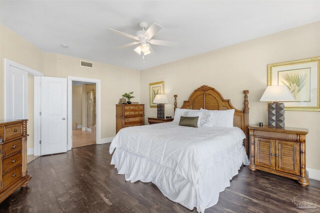 bedroom with ceiling fan and dark hardwood / wood-style flooring