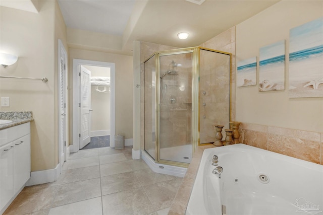 bathroom with tile patterned floors, vanity, and independent shower and bath