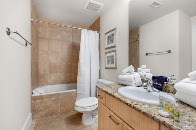 full bathroom featuring shower / bath combo with shower curtain, vanity, and toilet