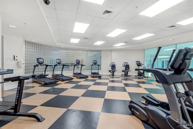 workout area with a paneled ceiling