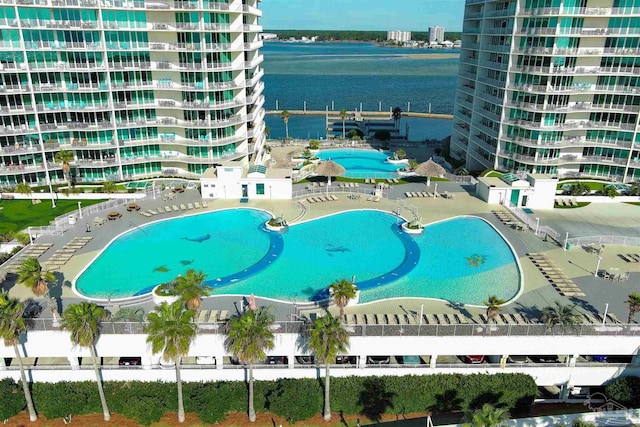 view of pool with a water view