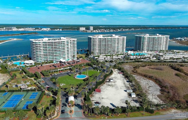 birds eye view of property with a water view