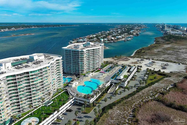 birds eye view of property with a water view